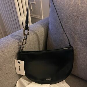 STAUD Black Half Moon Shoulder Bag with Gold Chain Accent